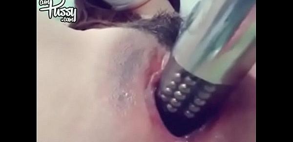  Brunette girl in mask masturbates with vibrator